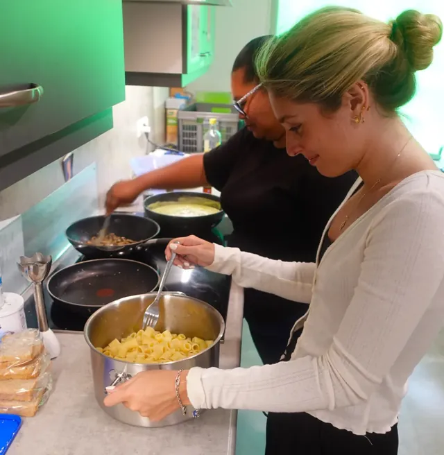 Volunteers cooking at Cello