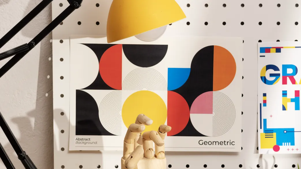 Design desk with geometric posters and colour swatches